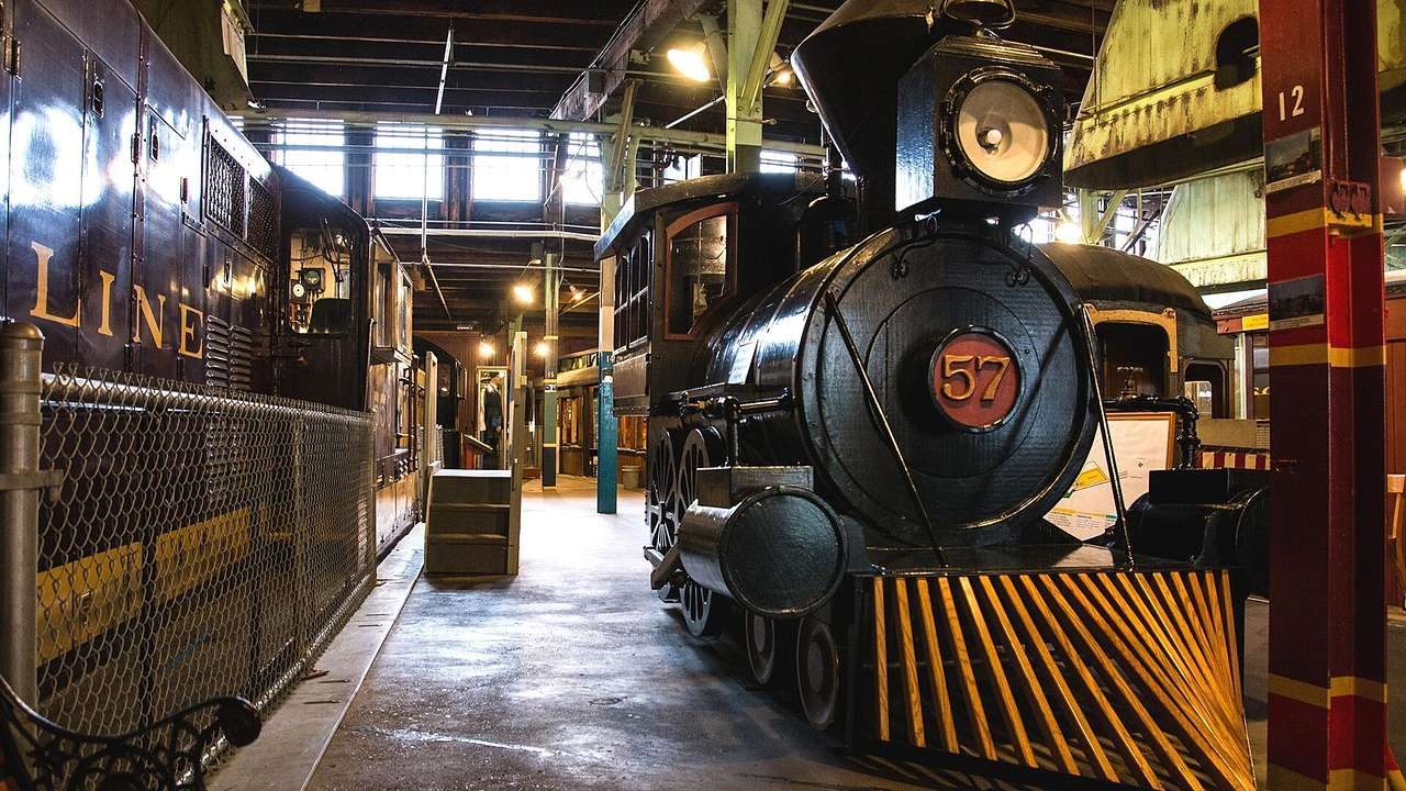 An old-fashioned train in an industrial-style museum