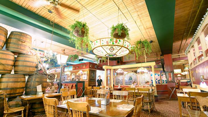 The interior of an Italian restaurant with wooden tables and chairs