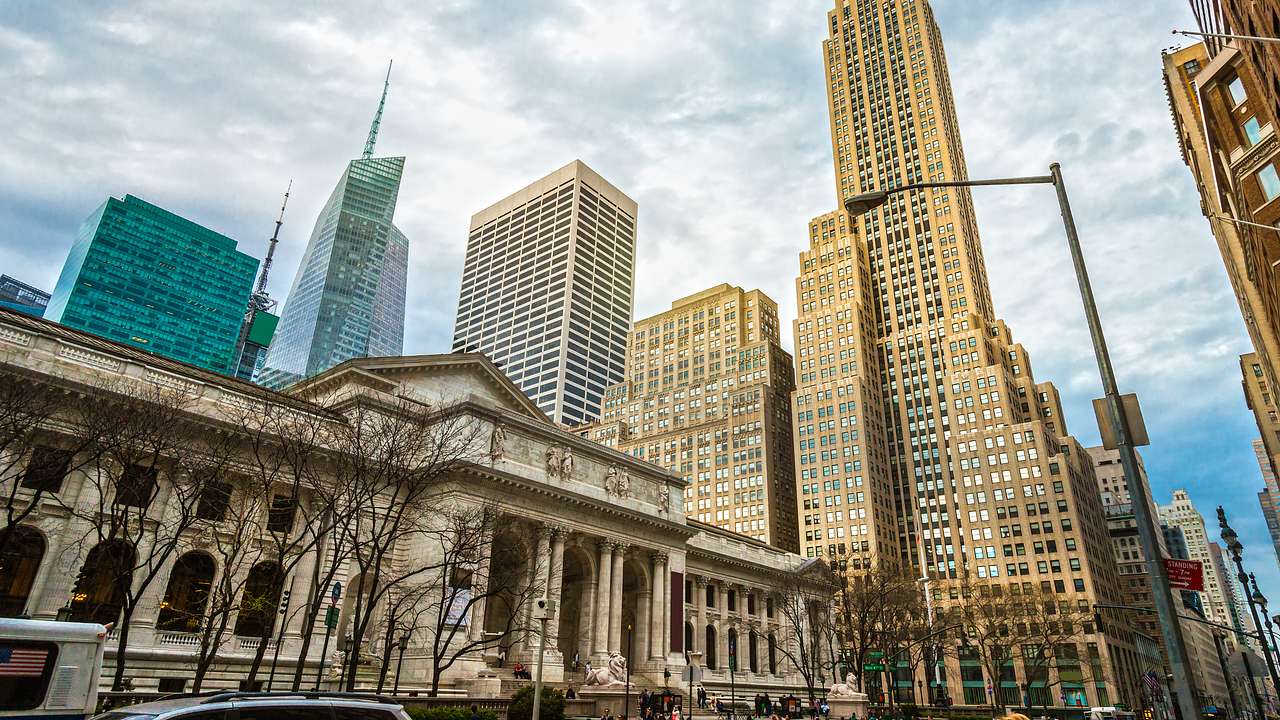 A Beaux-Arts-style marble building surrounded by skyscrapers