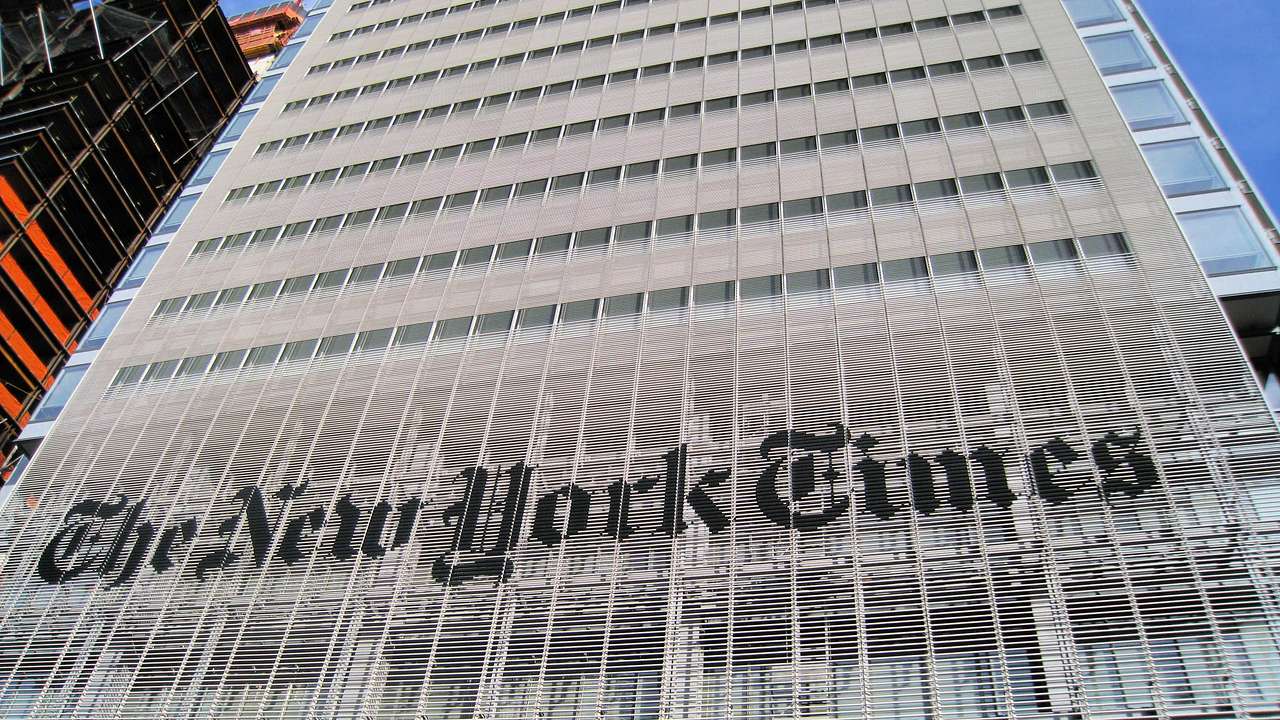 A building facade with a sign saying "The New York Times"