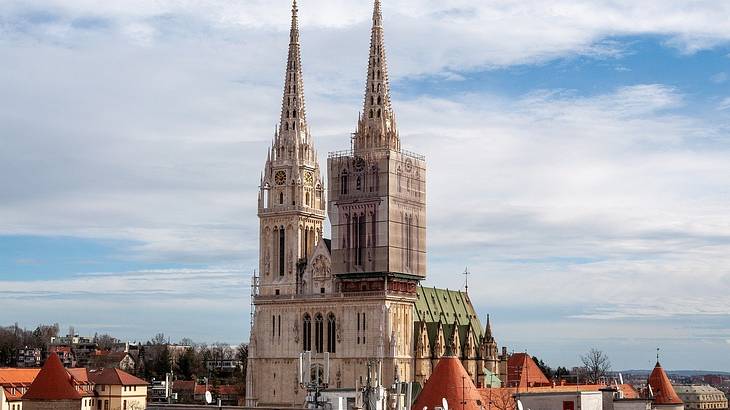 Top of the Zagreb Cathedral against a partly cloudy sky