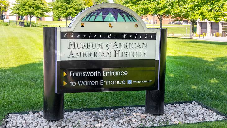 An entrance sign saying "Charles H. Wright Museum of African American History"