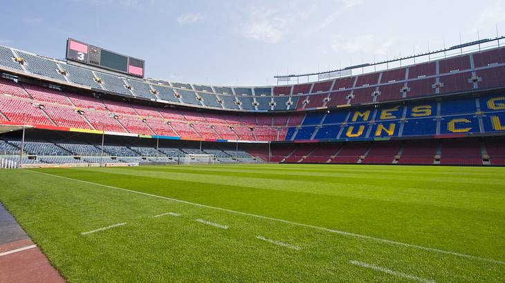 An empty Camp Nou stadium and grass field in Barcelona, Spain