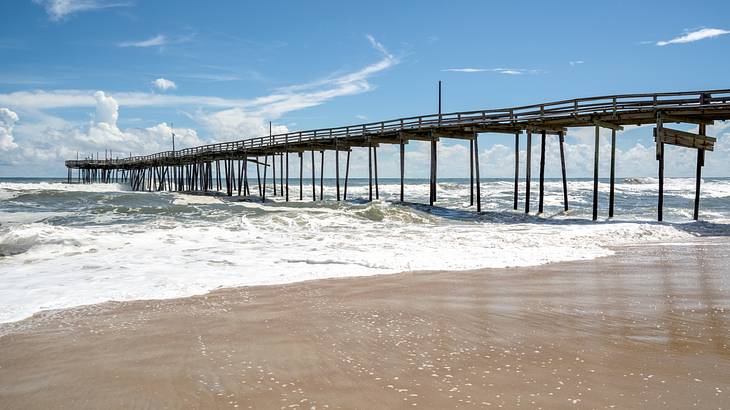 Waves crashing under the wooden Avon pier