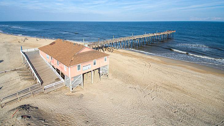 Aerial view of the Rodanthe Pier over water from the shore