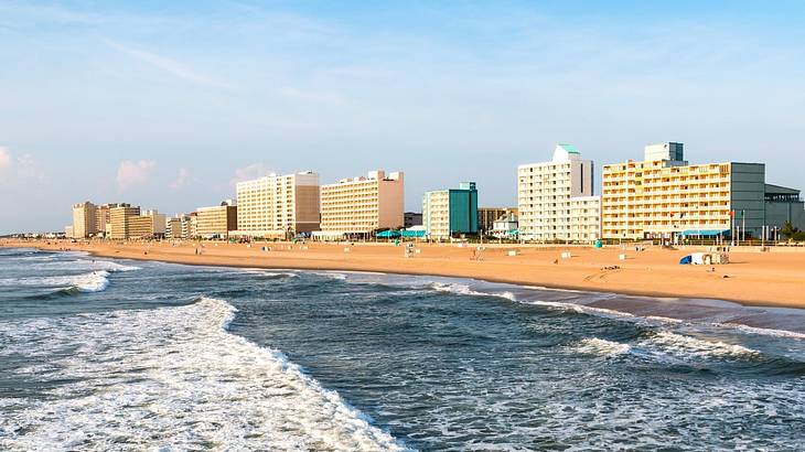 High-rise buildings overlooking a beach with shallow sea waves