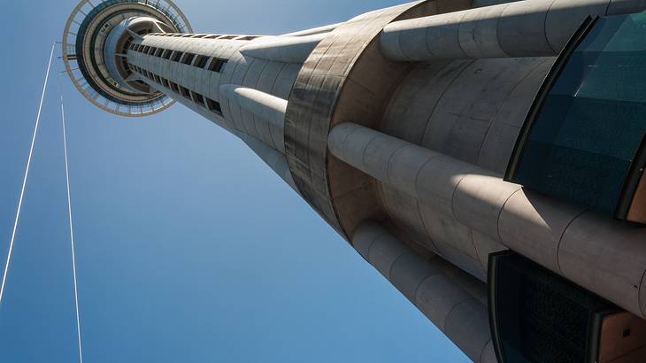 A tall tower at an angle from below against a blue sky