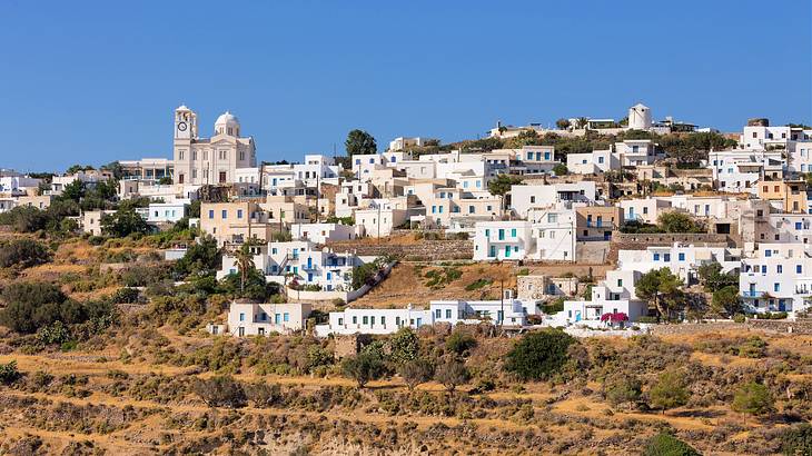 White structures on a hilly terrain on a sunny day