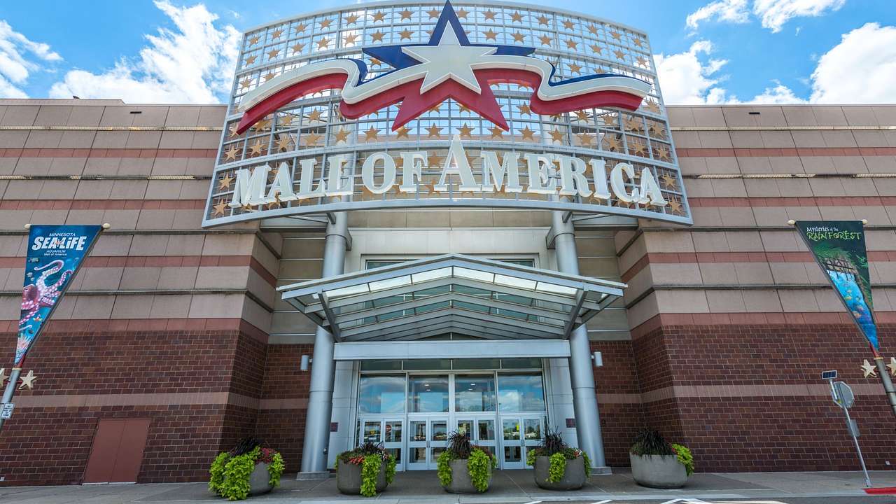 The entrance to a shopping mall with a sign that says "Mall of America"