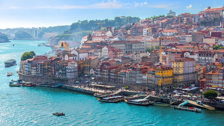 Colorful buildings near a body of water with boats on it