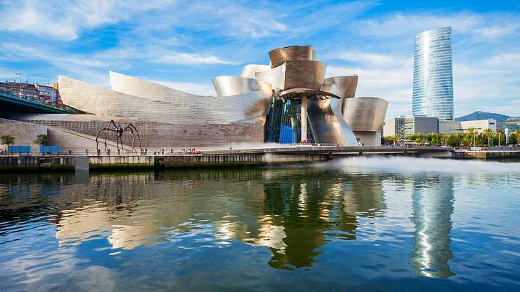 The interesting exterior architecture of a museum reflected in water