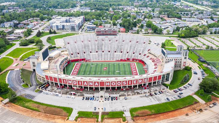 Aerial shot of a stadium with a football field and signage saying "Indiana Hoosiers"