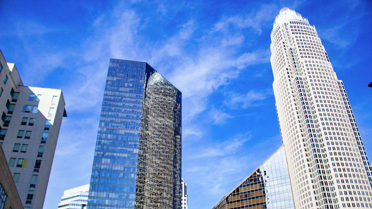 A low-angle shot of modern skyscrapers on a sunny day