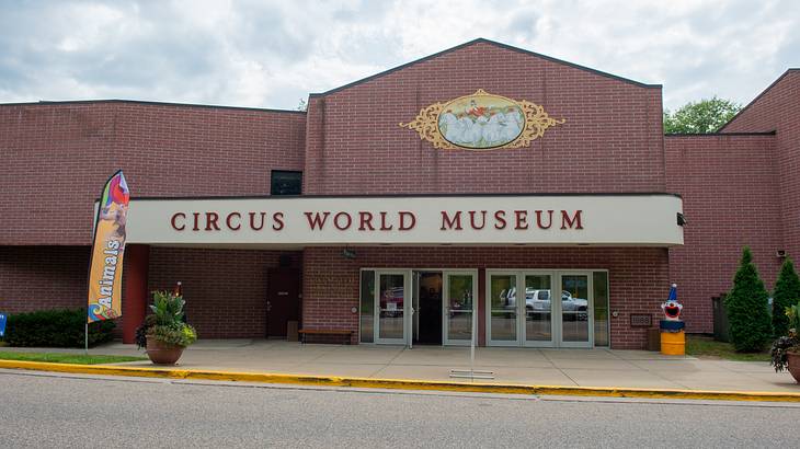 An entrance to a red brick building with the words "Circus World Museum"