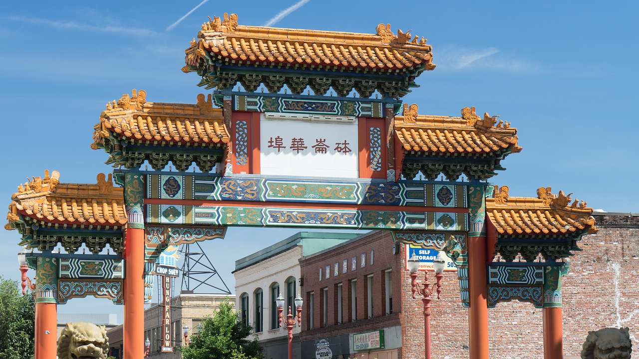 A traditional Chinese-style arch next to buildings