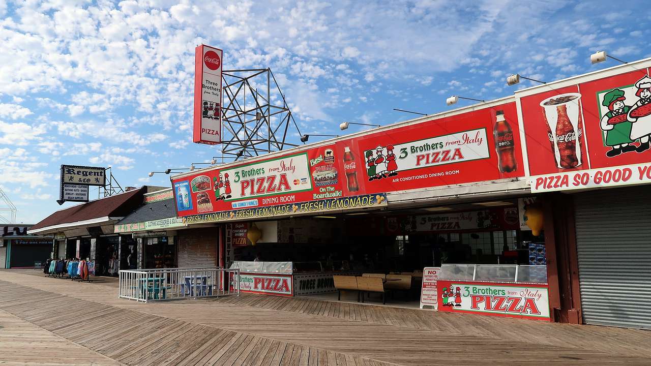 A commercial establishment with signs saying "3 Brothers from Italy Pizza"
