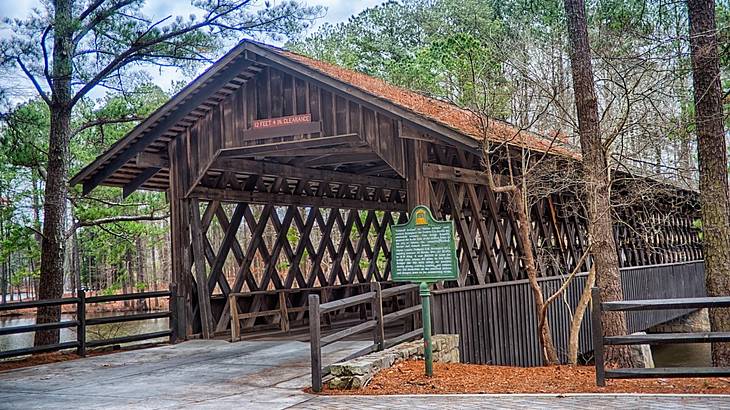 A wooden structure in a forested area