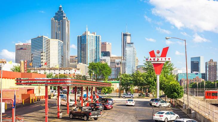 A drive-through fast-food restaurant with a red sign that says "Varsity"