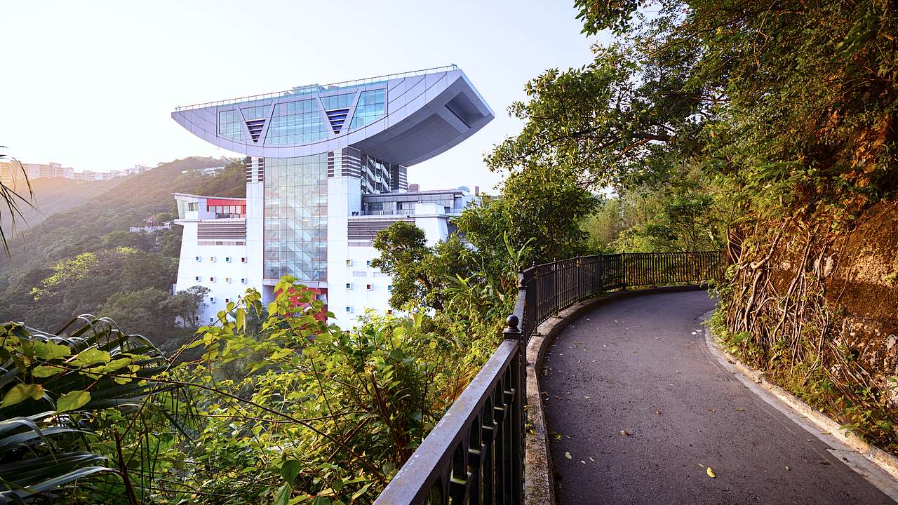 A glass building on a green peak, Hong Kong
