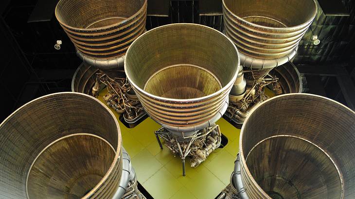 Looking down into the metal exhaust pipes of rocket engines