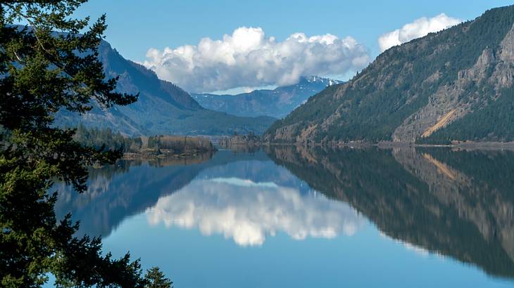 A body of water surrounded by mountains