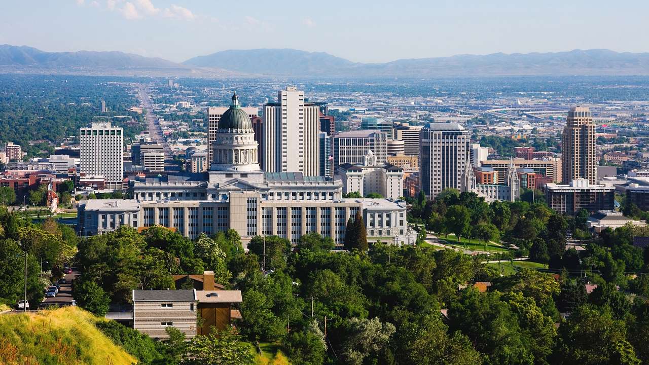 A view over Salt Lake City, with the State Capitol, other buildings, and trees