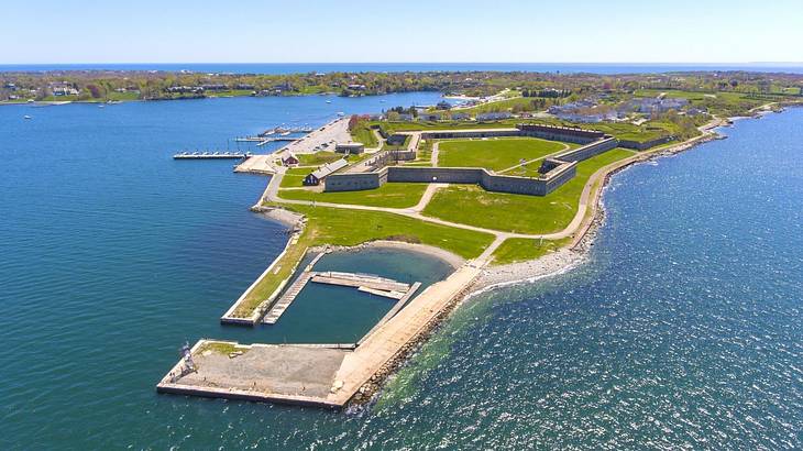 Aerial view of a fort with ocean surrounding it