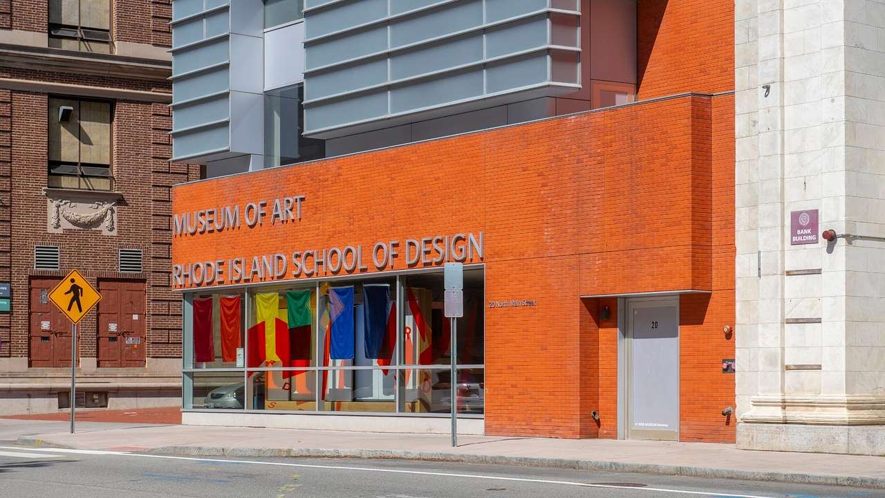 An orange building with a "Museum of Art Rhode Island School of Design" sign
