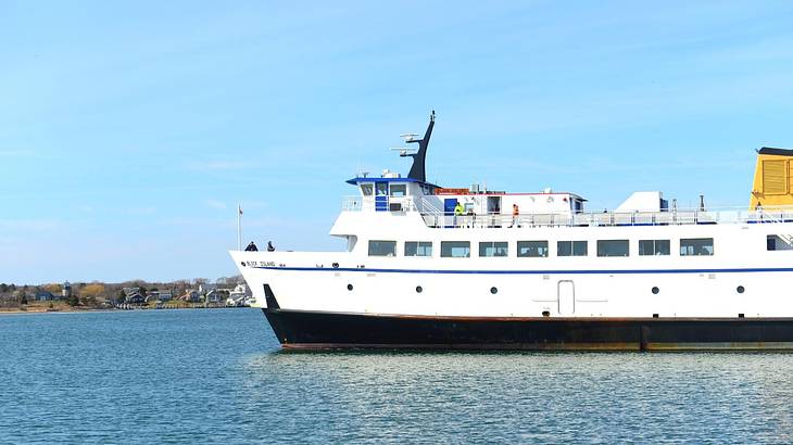 A ferry on the water under a clear blue sky