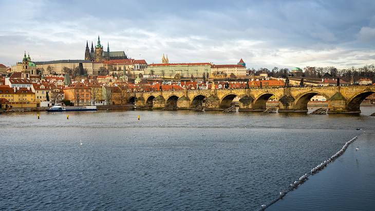 An impressive view of Charles Bridge with Prague Castle in the background