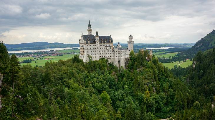Neuschwanstein Castle perched at the top of a hill, Bavaria, Germany
