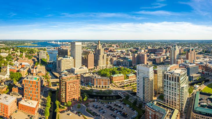 An aerial shot of a city with buildings on a sunny day