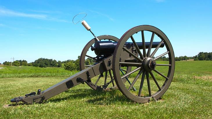 A civil war era cannon on green grass