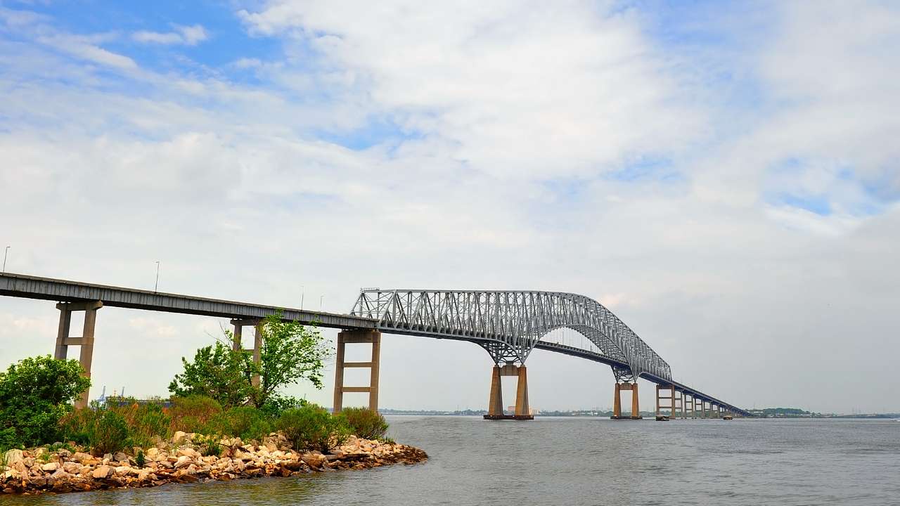 A bridge over Chesapeake Bay under a blue sky with clouds