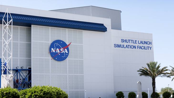 NASA's Shuttle Launch Simulation Facility building with greenery in front