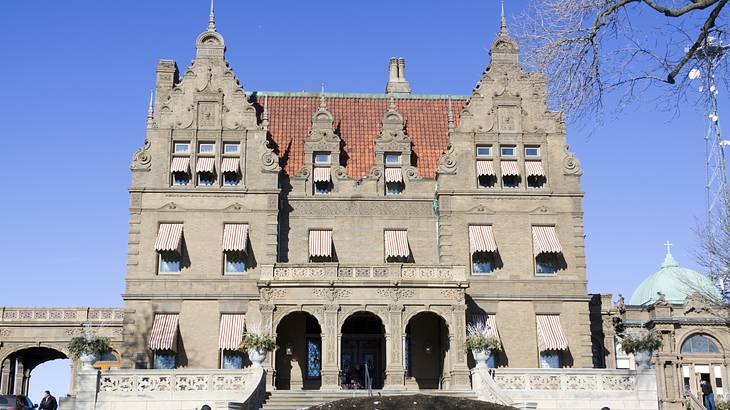 A Flemish-Renaissance-Revival style building next to snow on the ground