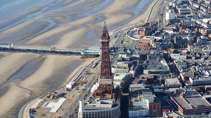Aerial view of a tower overlooking a beach and buildings Aerial view of a tower overlooking a beach and buildings