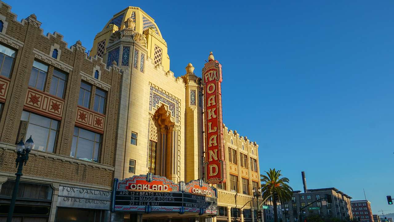 An old-fashioned theater building with a red sign that says "Fox Theater"