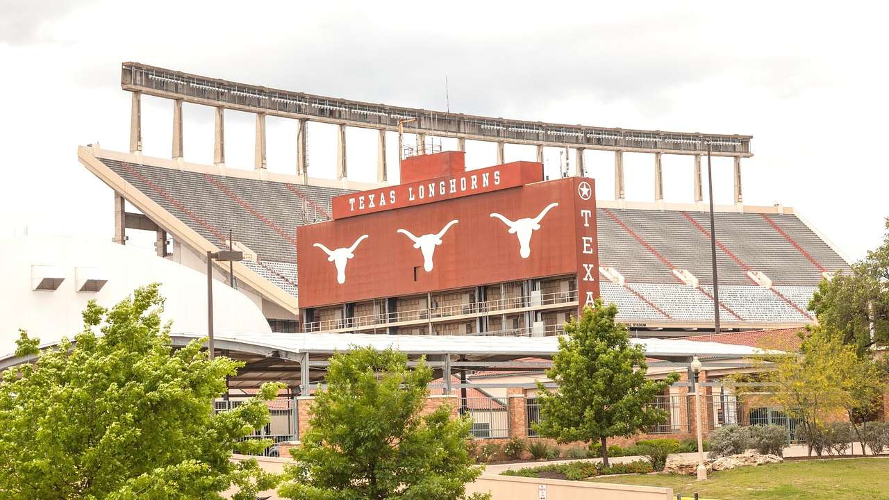 A sports stadium and a sign that says "Texas Longhorns"