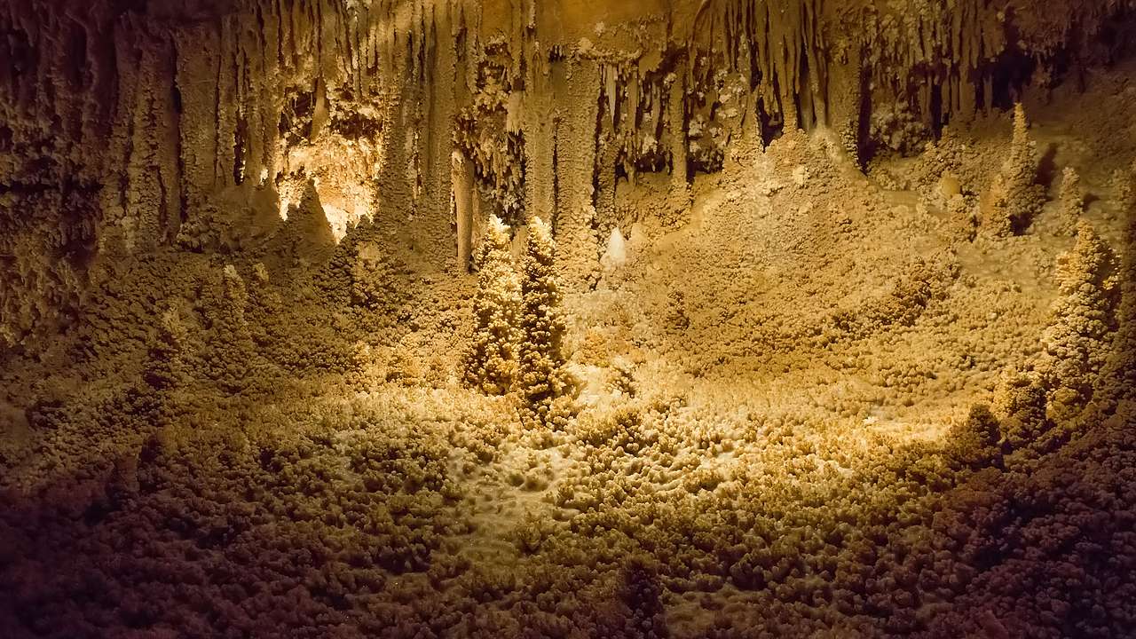 An underground cavern with brownish-colored formations all around