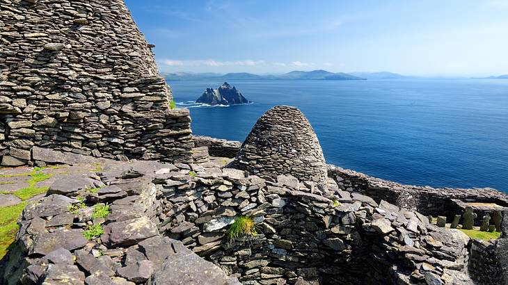 View of rocky islands in an ocean from the ruins of a monastery