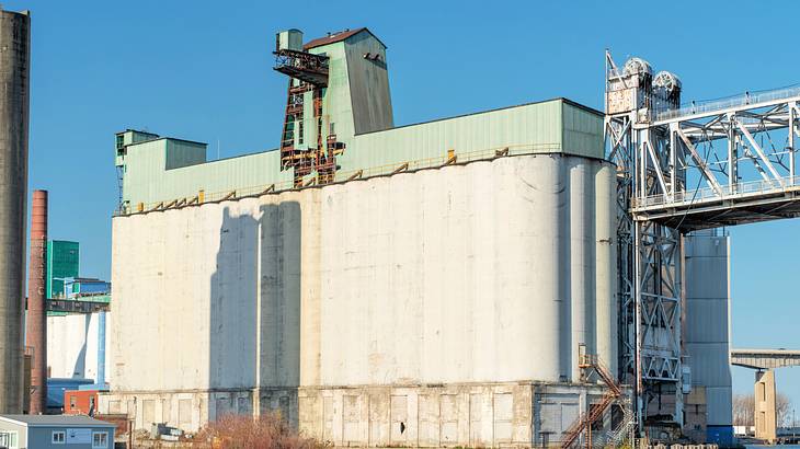 Old grain elevators near a body of water