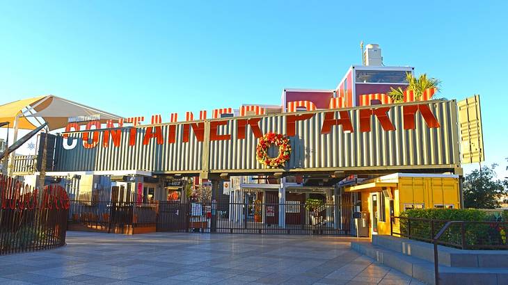 A container with a "Container Park" sign on it and a square in front