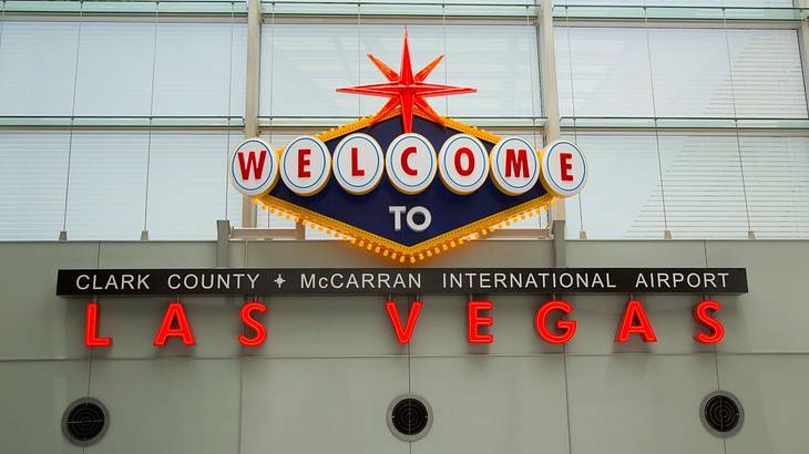 A McCarran International Airport sign and Welcome to Las Vegas sign