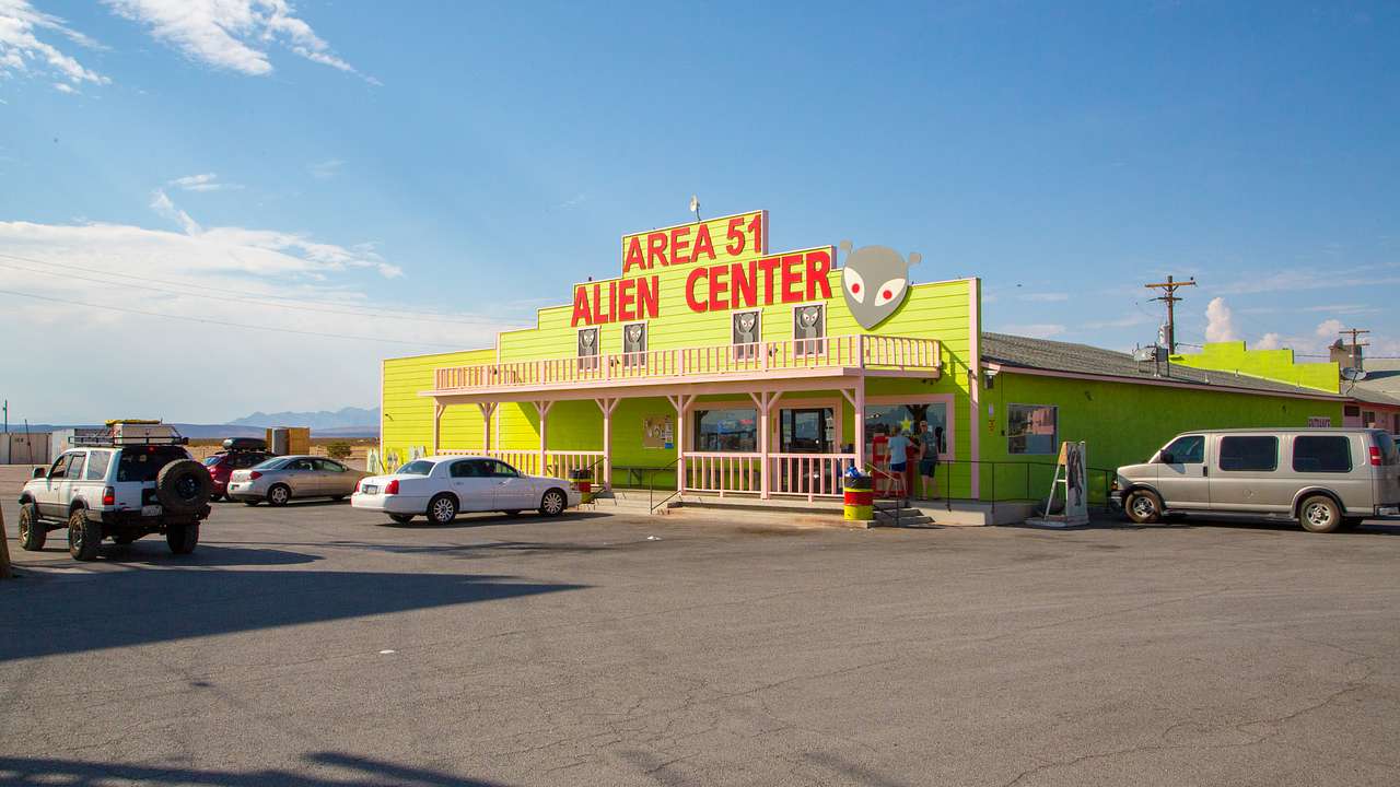 A store with a large yellow front and a sign that reads Area 51 Alien Center