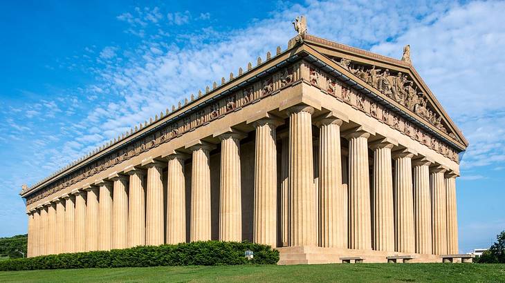 A Greek-style Parthenon with columns and stone carvings