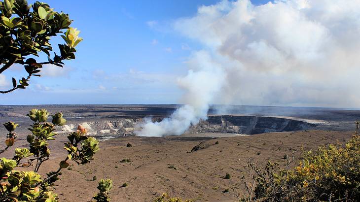 Steam coming out from a volcano crater on a sunny day