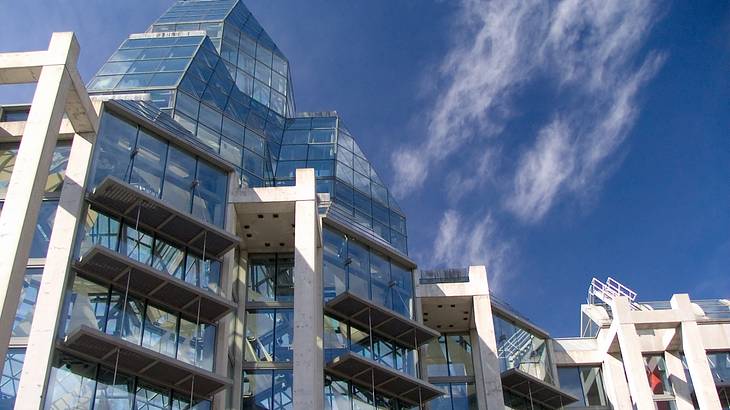 A building from below with floor-to-ceiling glass windows