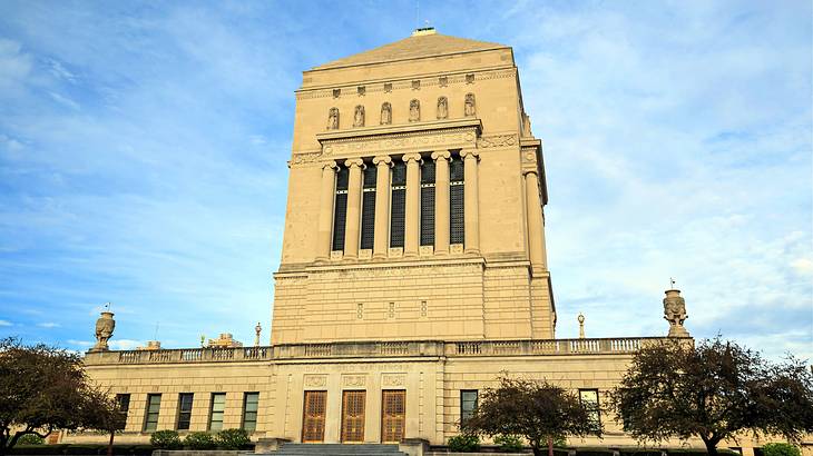 A Neoclassical building with ionic columns and a pyramidal dome