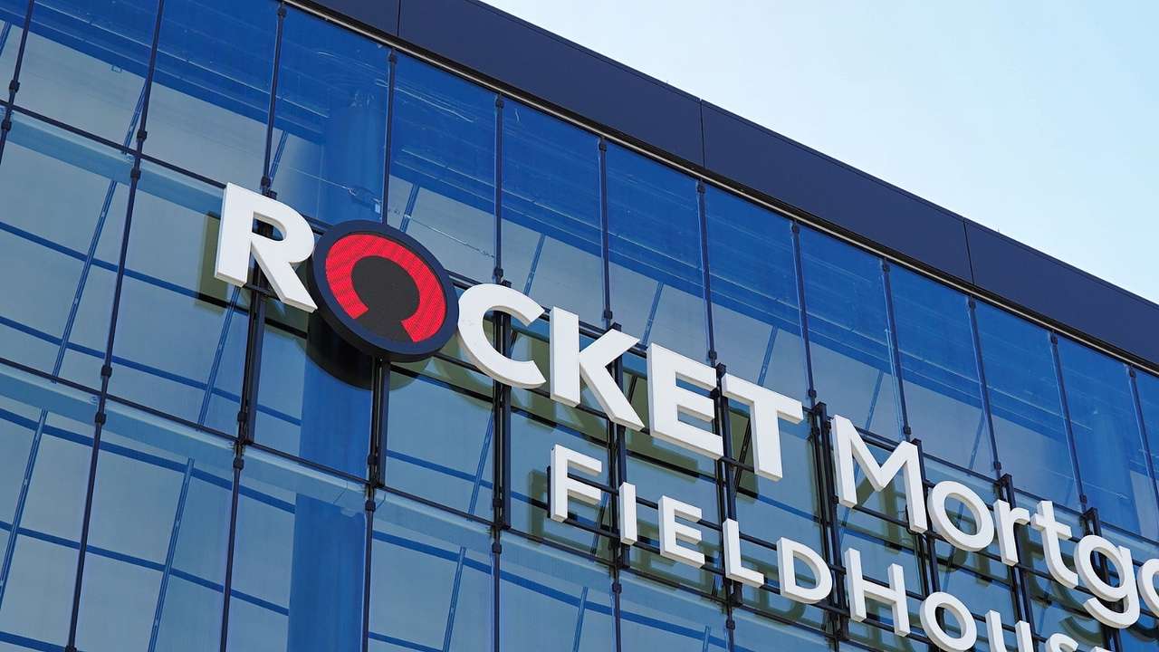 A glass building with a sign that says "Rocket Mortgage FieldHouse"